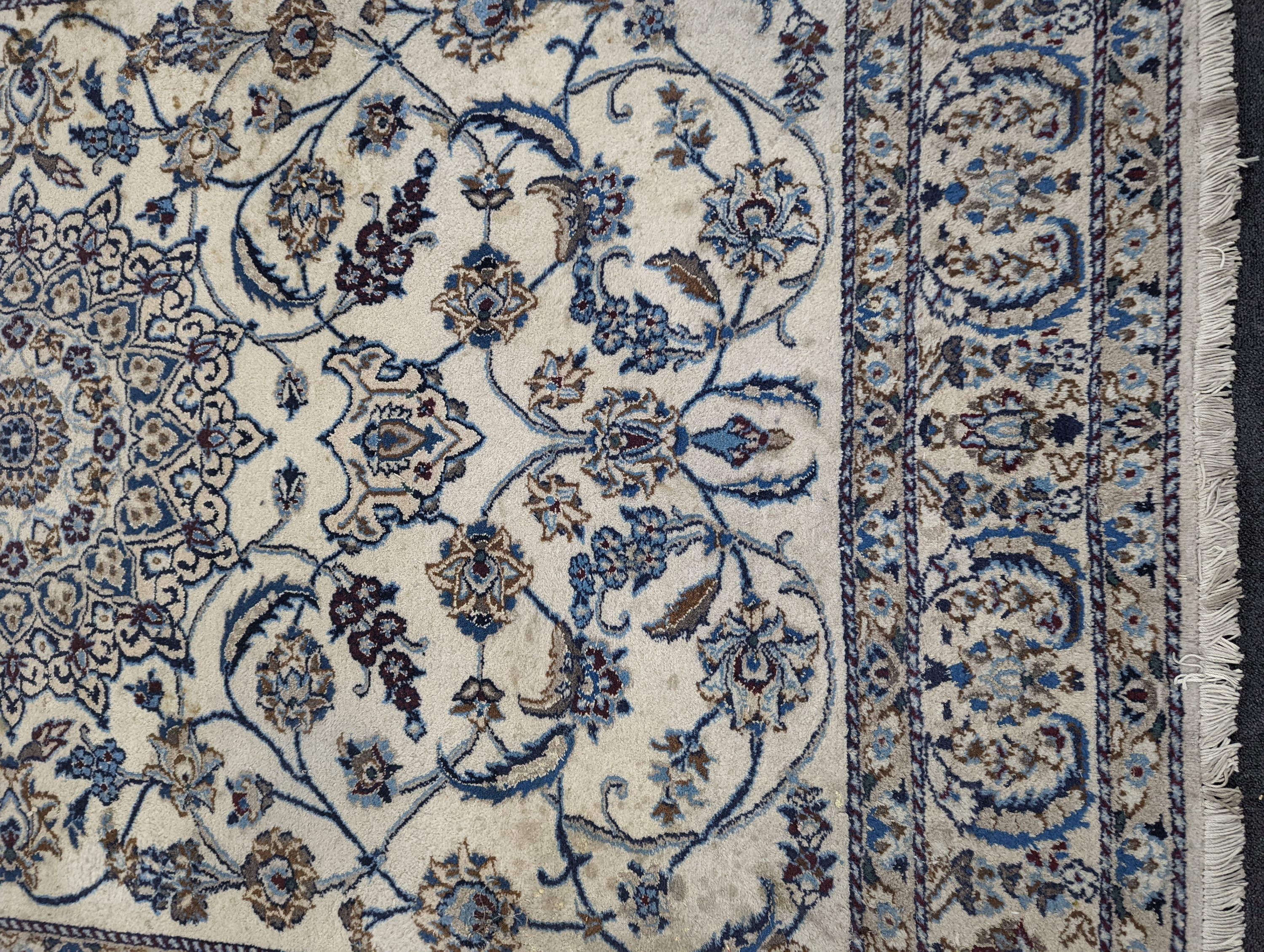 An ivory ground Nain carpet, 290 x 205cm